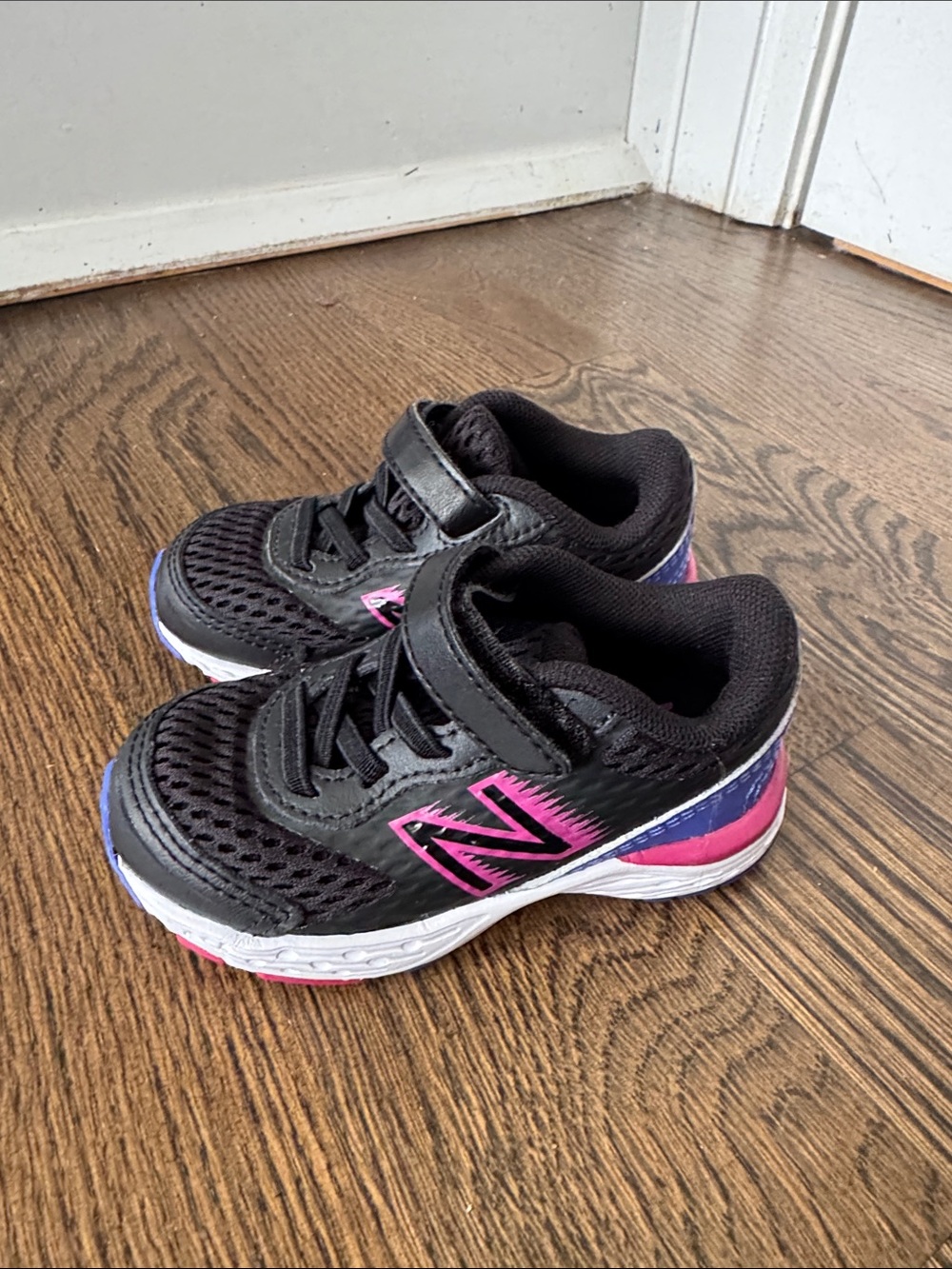 New Balance Kids Black Sneakers with Pink and Purple Accents
